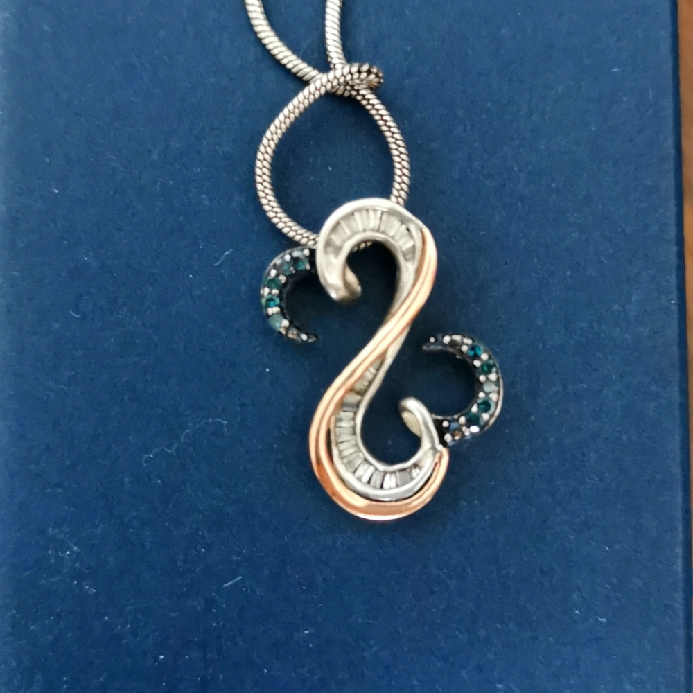Open hearts by Jane Seymour . Blue and white diamond pendant.